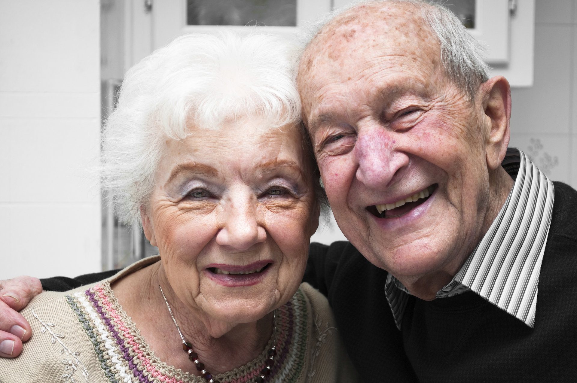 a senior couple smiling